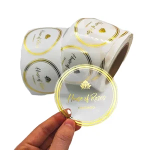 Custom Waterproof Transparent Round Roll Labels with Clear Gold Foil Logo and Hot Stamping