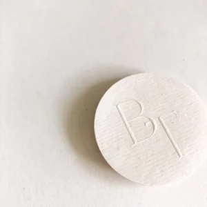 Custom White Embossed Textured Paper Round Labels with Logo for Product Packaging