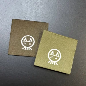 Custom Woven Damask Satin Clothing Labels with 3D Embossing, Gold Adhesive Backing, Iron-On and Sew-On Options