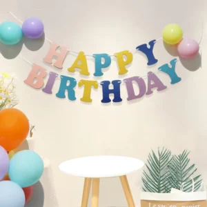 Macaron Letter Banner for Birthday Parties with Paper Flag Decorations and Flower Arrangements
